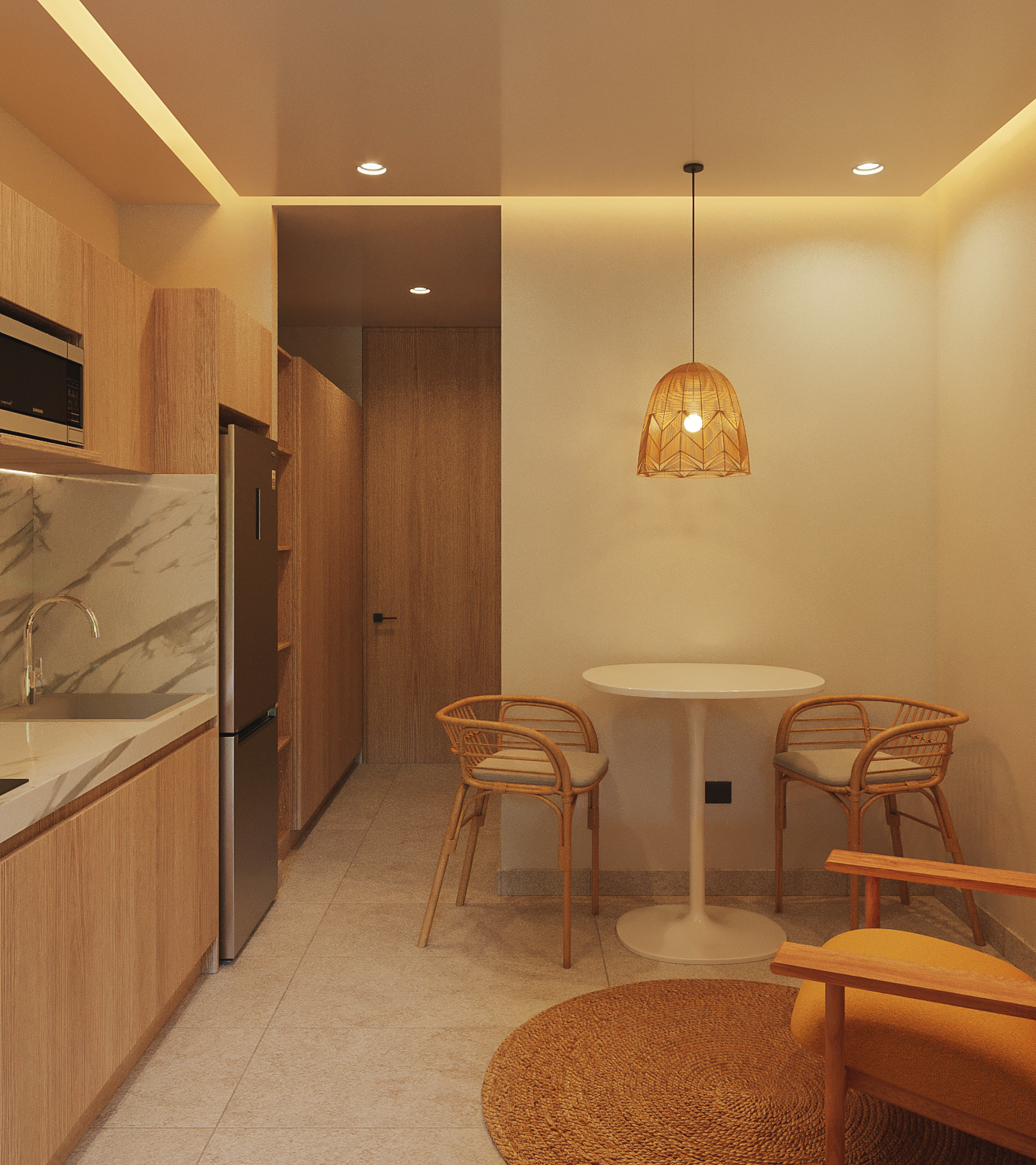 Cocina y área de comedor en Macondo Tulum con acabados en madera, mármol y fibras naturales, iluminación cálida y mobiliario artesanal, parte de los departamentos en venta en Tulum con estilo contemporáneo.