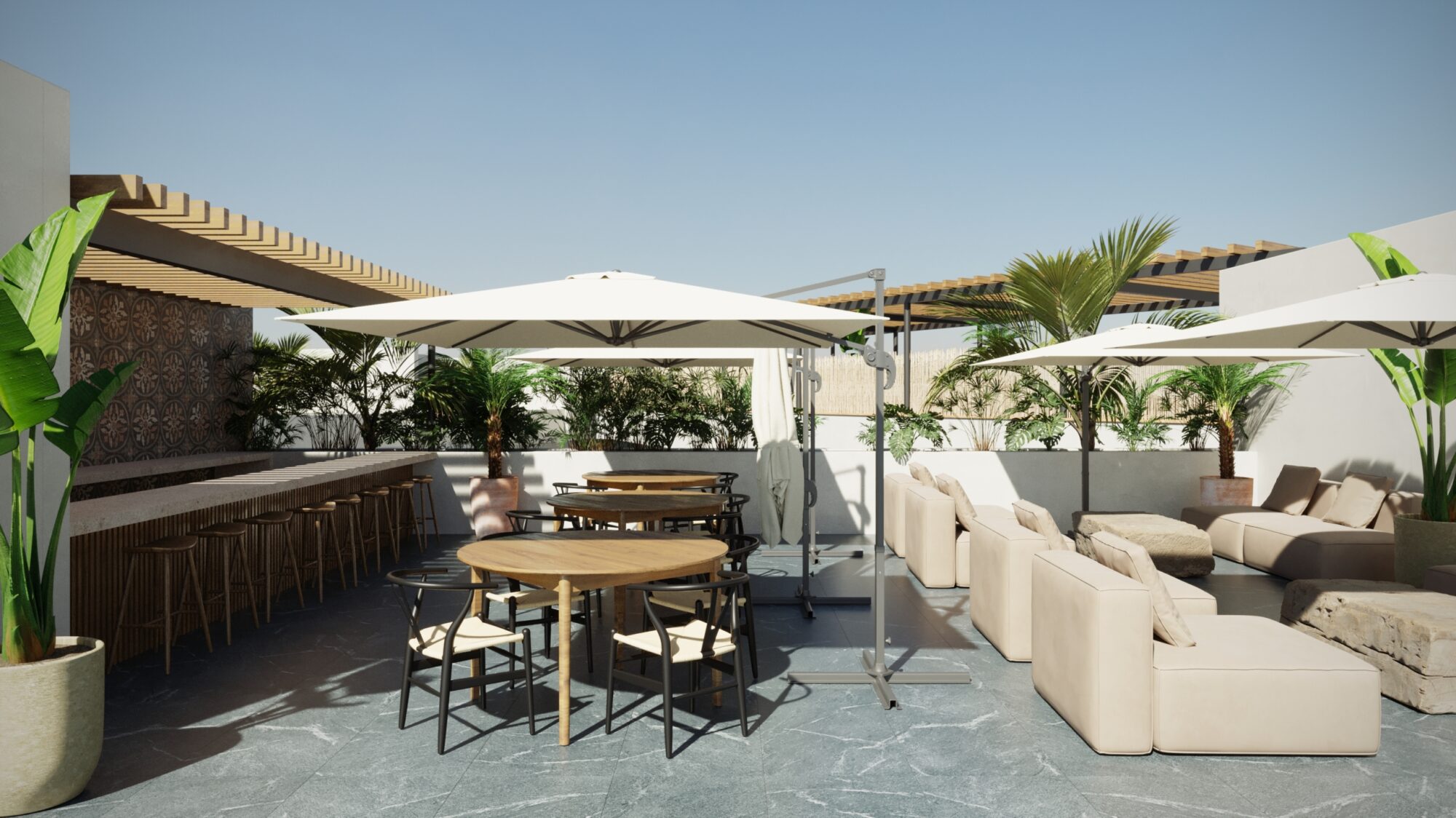 Rooftop social de Macondo Tulum con área de bar, mesas de madera, sombrillas blancas, sillones lounge y vegetación tropical, parte de las amenidades de los departamentos en venta en Tulum.