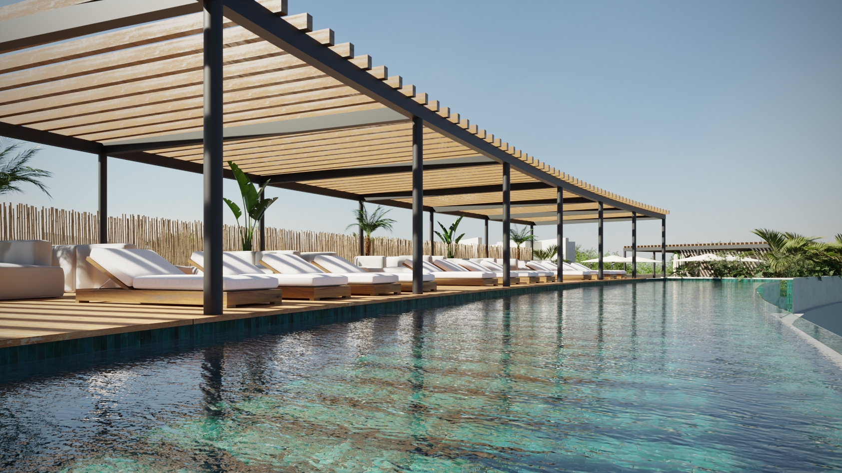 Rooftop de Macondo Tulum con alberca infinity, camastros de diseño contemporáneo bajo pérgolas de madera y vegetación tropical, en un entorno relajante dentro de los departamentos en venta en Tulum.